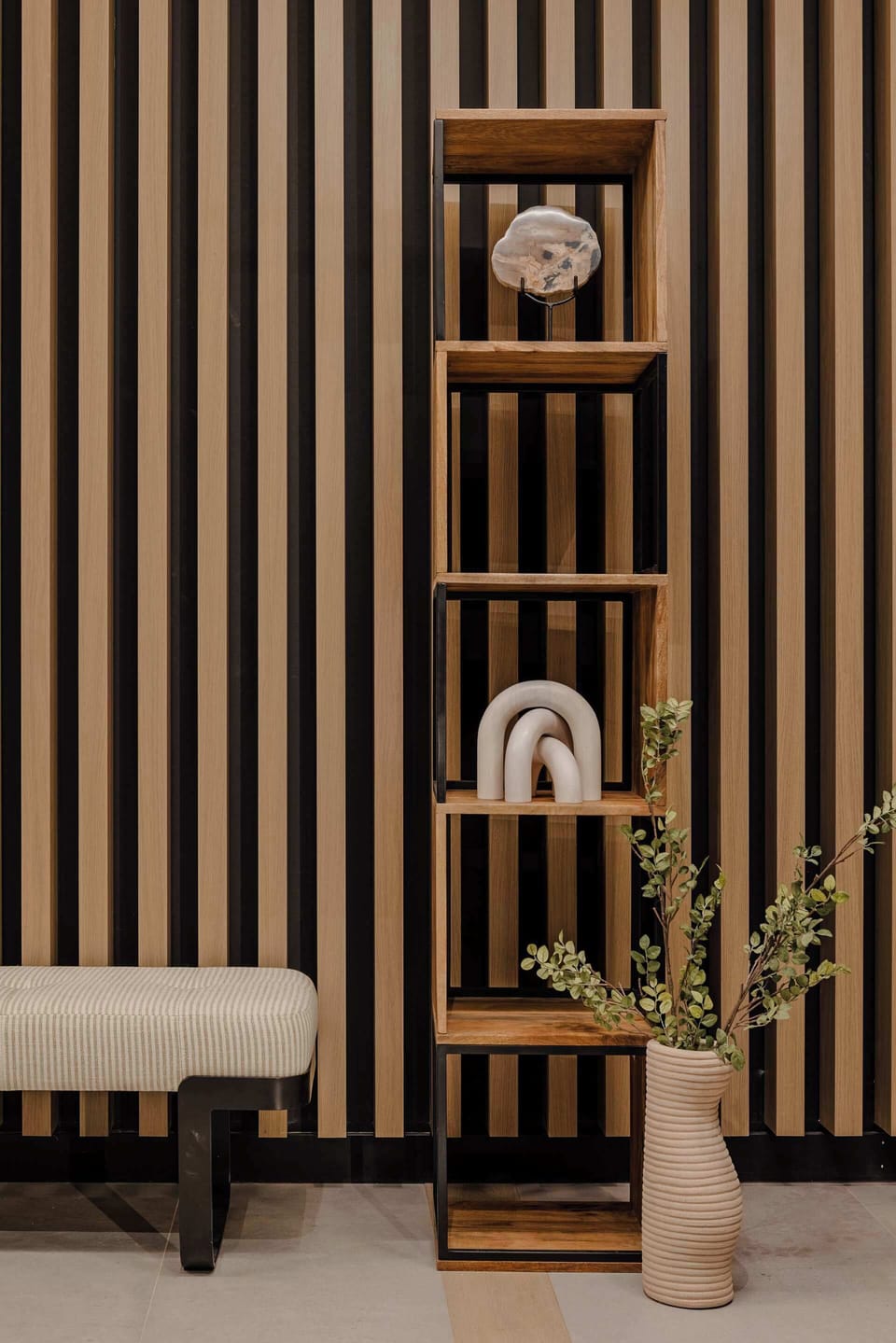Stylish shelving detail with natural decor and lighting

