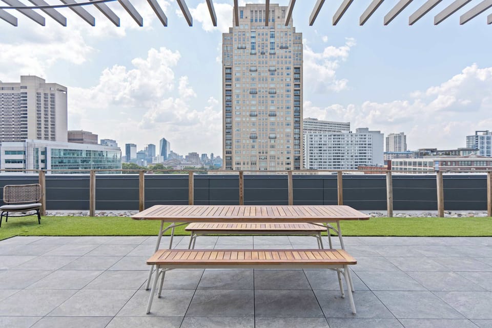 Rooftop terrace with city views and outdoor seating