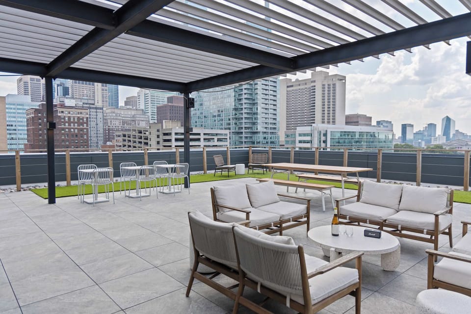 Rooftop terrace with city views and outdoor seating