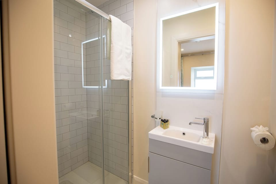 Shower, hair dryer, towels, soap