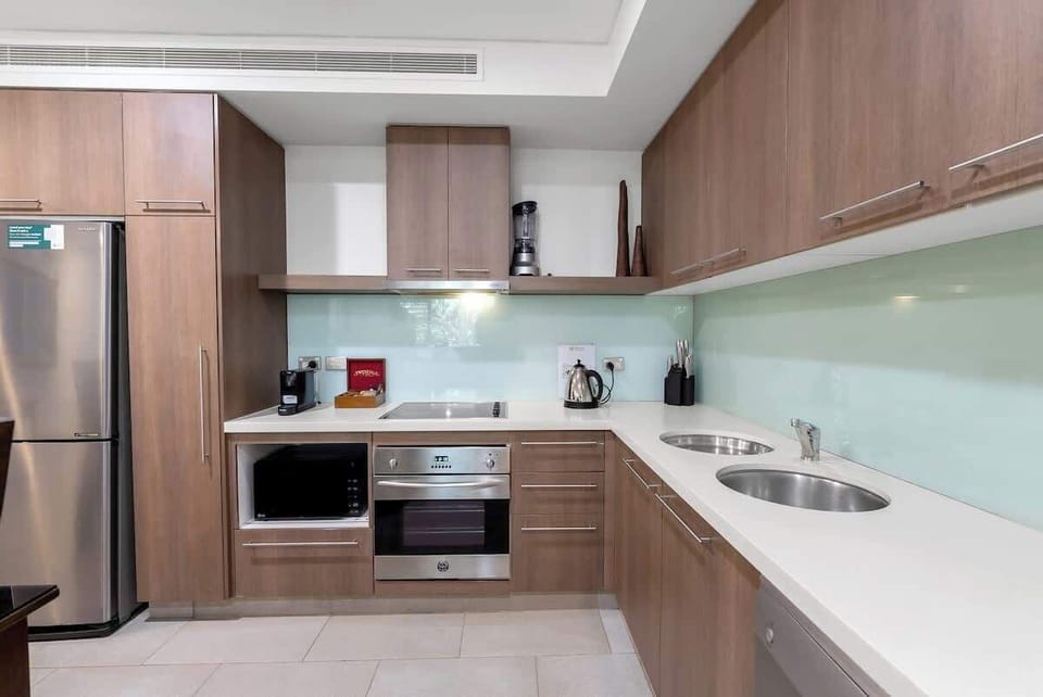 Enjoy preparing local ingredients in the modern kitchen, complete with an oven, dishwasher, coffee machine, expansive benches, and all you need for casual meals or special dinners.