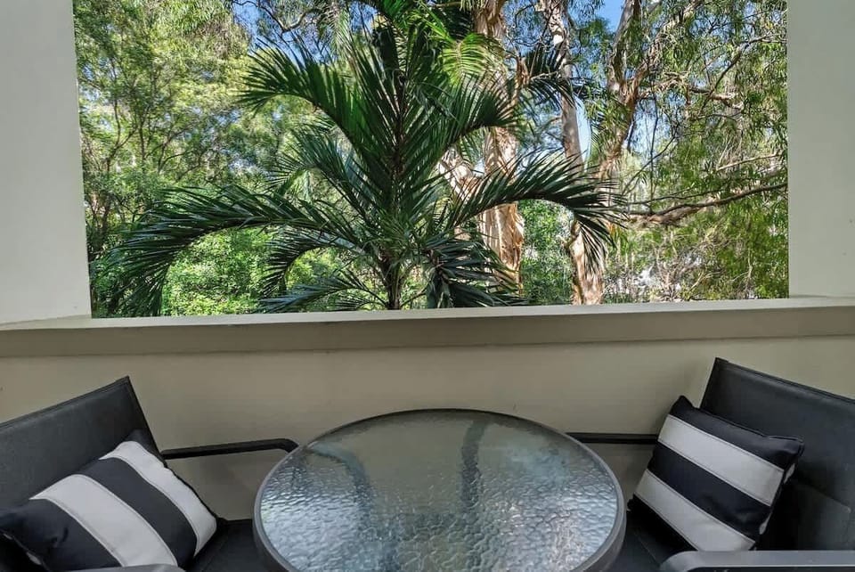 Enjoy slow breakfasts or evening wine from your private balcony, where the surrounding bushland offers total privacy and a peaceful backdrop.