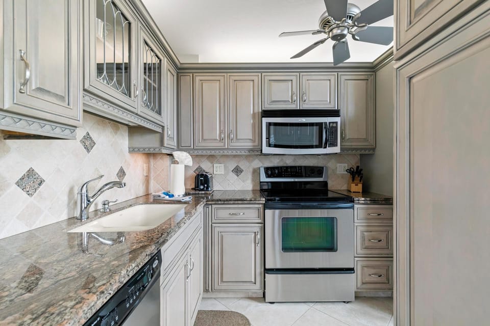 Kitchen with updated cabinetry and stainless steel appliances