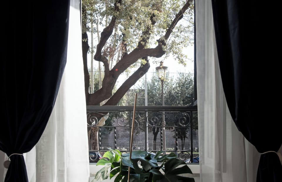 Deluxe Quadruple Room, City View | Desk, laptop workspace, blackout drapes, soundproofing