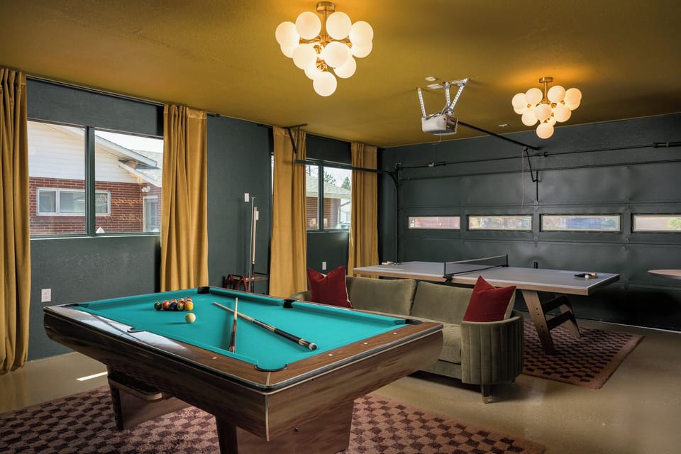A vibrant entertainment zone with pool, ping pong, and lounge seating for endless fun with friends.