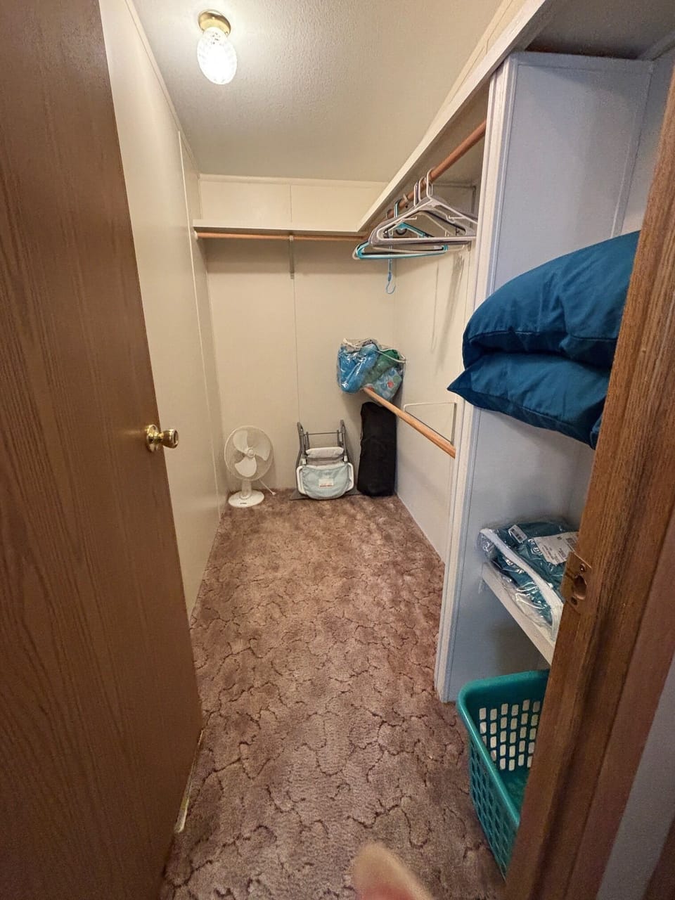 Full walk in closet. Shelving and rods with hangers for your clothing.