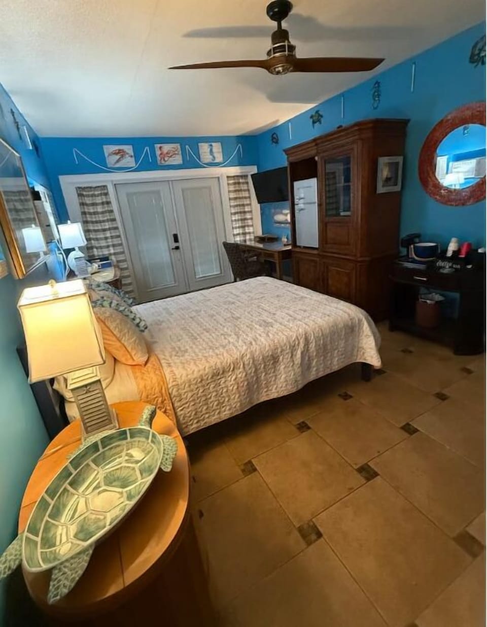 Large bedroom with queen bed, luxury pillows, huge closet & fun tropical decor !