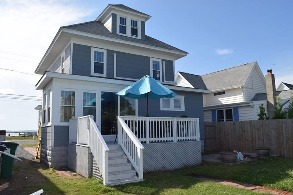 Rear deck overlooks the fenced back yard.