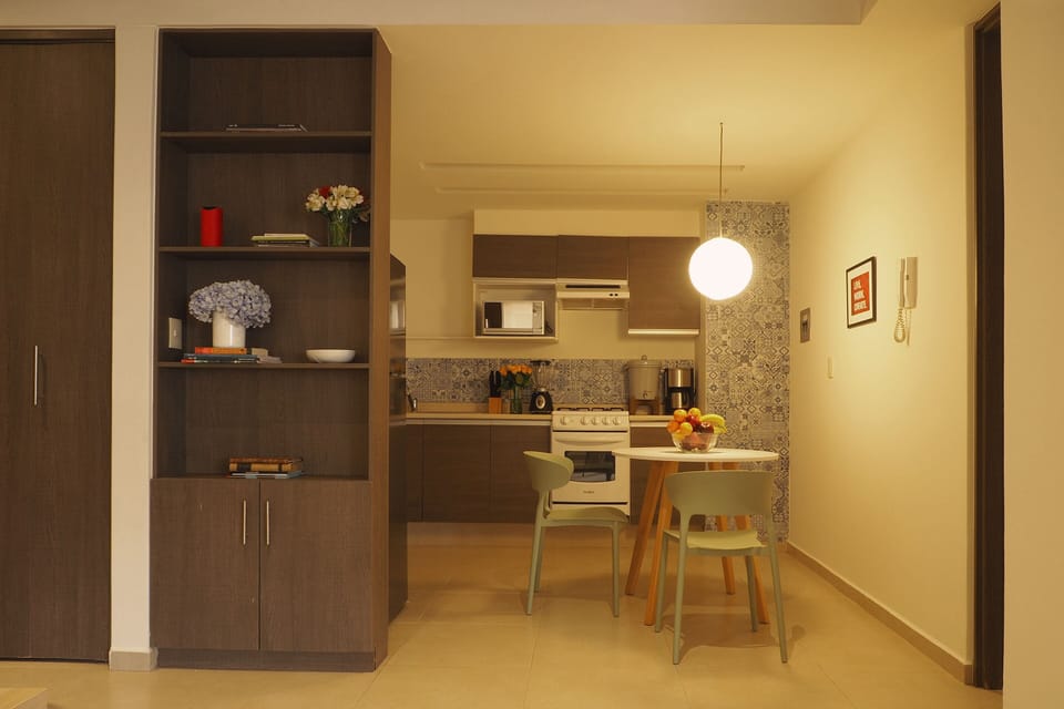 Deluxe Loft, 1 King Bed, Kitchenette, Ground Floor | Private kitchen | Full-size fridge, microwave, oven, stovetop