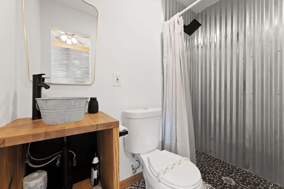 Clean bathroom with walk-in shower.