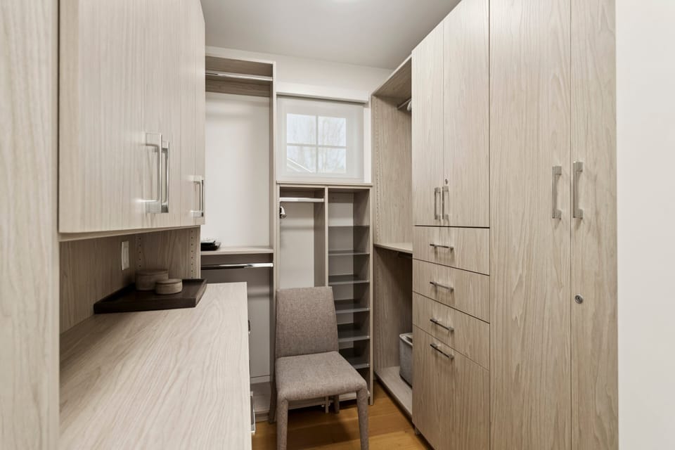 primary walk in closet with tons of storage
