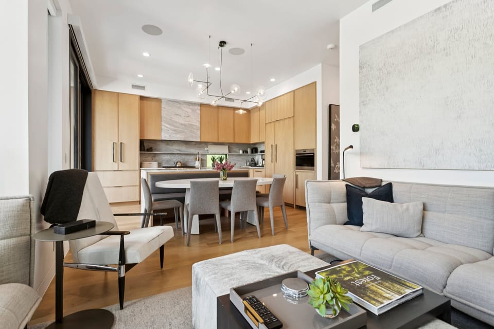 view of the kitchen with breakfast bar, dining table and large chef's oven