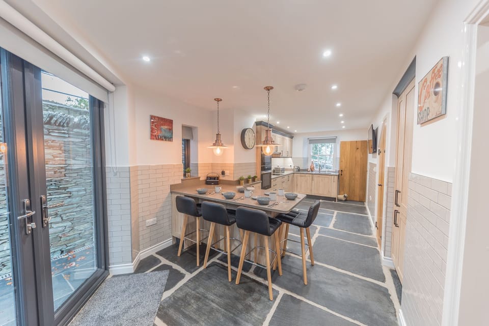 Cragg Cottage kitchen showing double doors out to rear patio