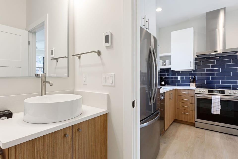 Freshen up in this stylish bathroom with marble-inspired finishes and a spacious shower.