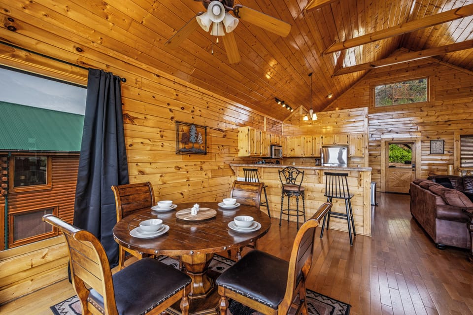 Cook, eat, and relax together in this airy open floor plan cabin