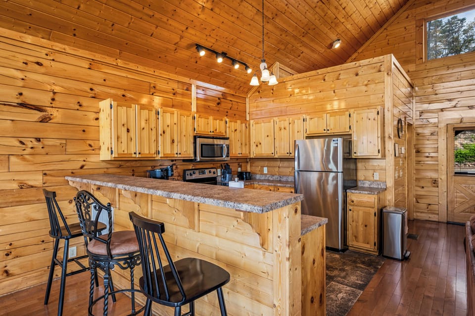 Sip, snack, and socialize at the cabin’s kitchen bar

