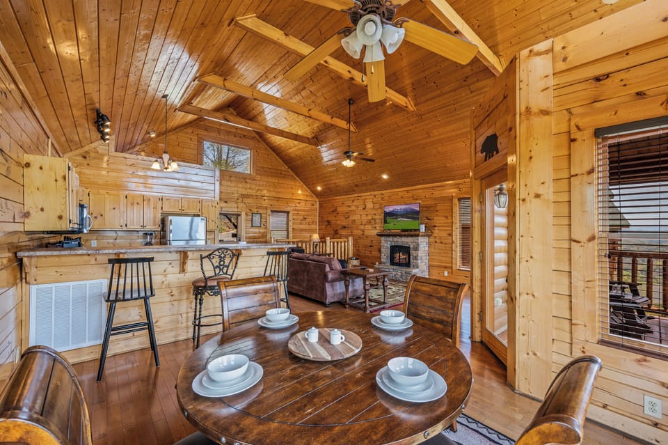 Cook, eat, and relax together in this airy open floor plan cabin