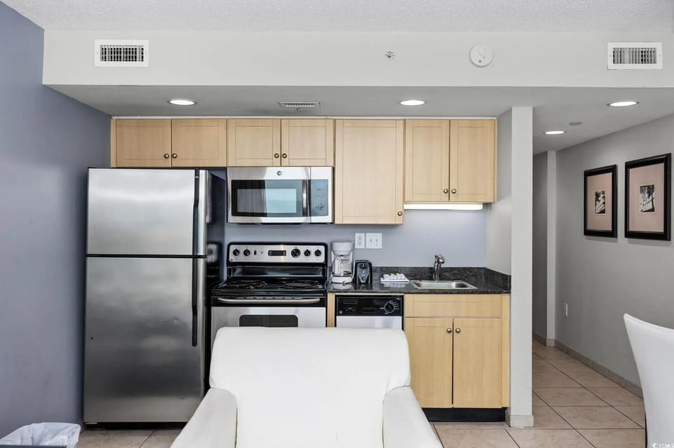 Modern kitchen with stainless steel appliances and ample counter space