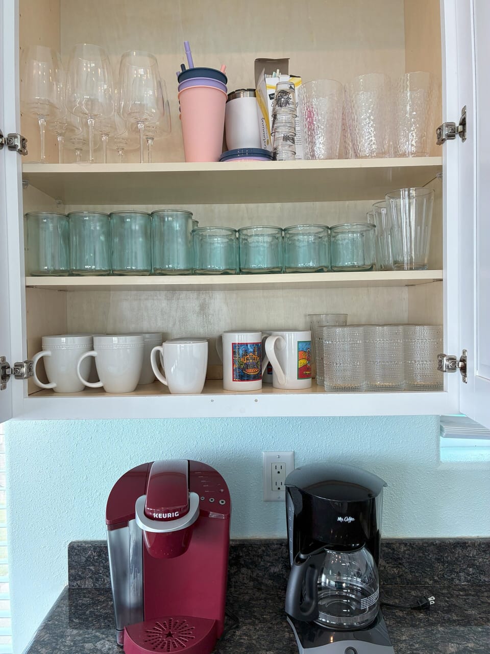 Everything you need: mugs, wine glasses, and both drip & Keurig coffee makers.