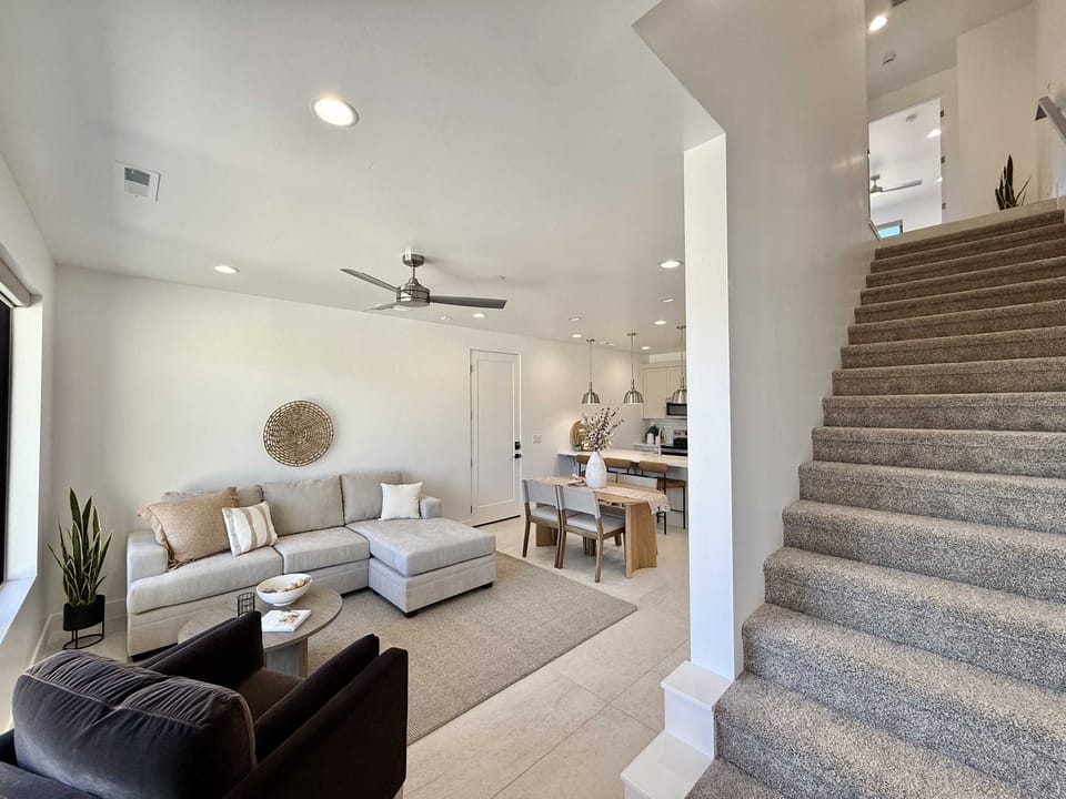 Upon entering Grand G5 you will find a tastefully decorated living room, dining and kitchen on the main level along with a primary suite and half bathroom. Head upstairs to find 2 more bedrooms, 2 full bathrooms, and a laundry room