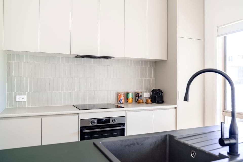 Start your day right with a fresh brew from the Nespresso coffee pod machine, whether you sip it at the island bench or outside on the sunny deck