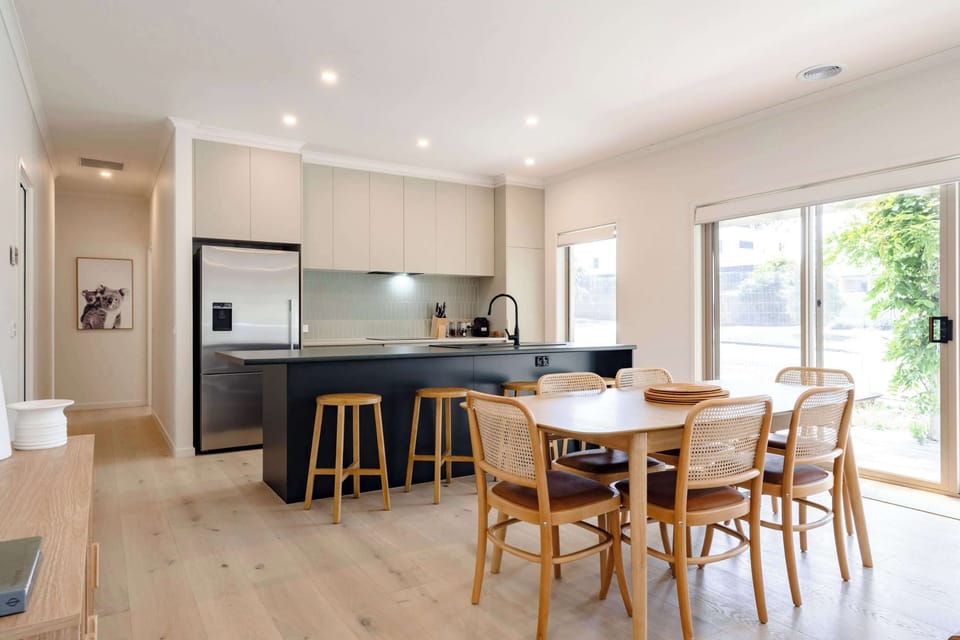 The kitchen, dining, and living area is a cosy setting that's designed for connection
