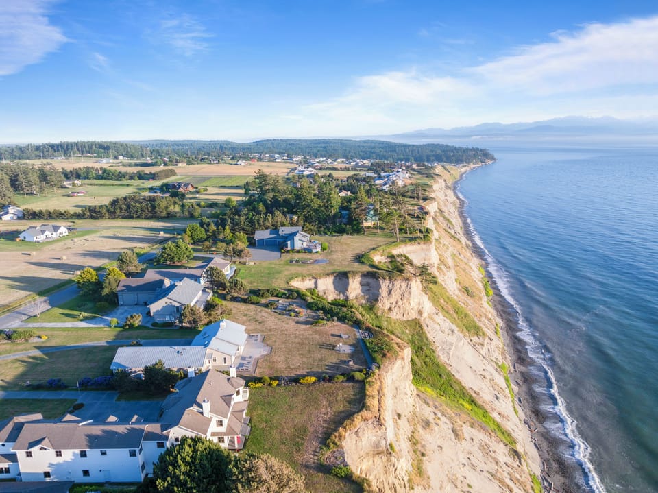 Waterfront home with dramatic bluff-top views of the coastline.