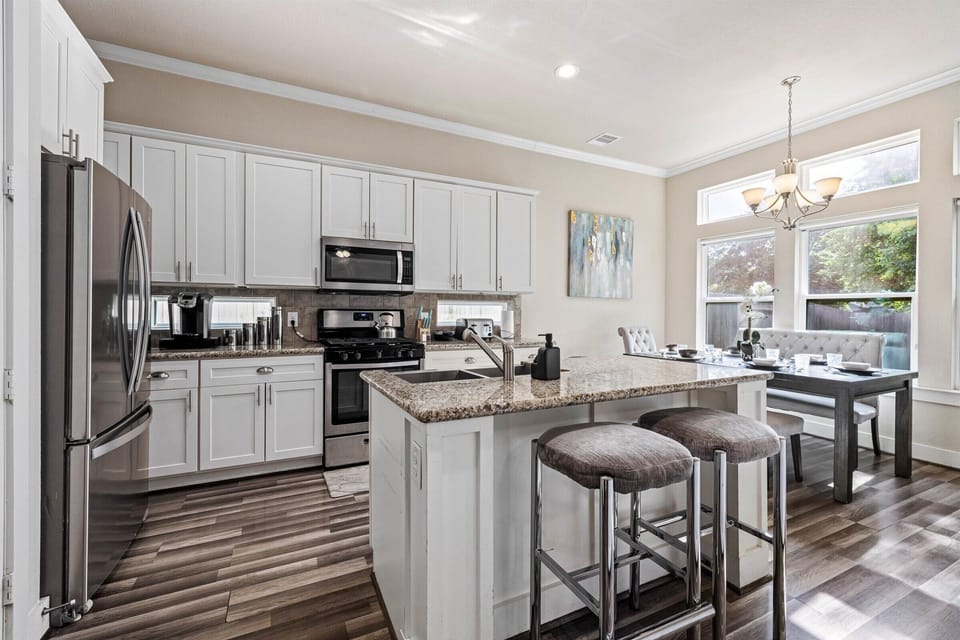 Kitchen island with 2 bar stools for your convenience.