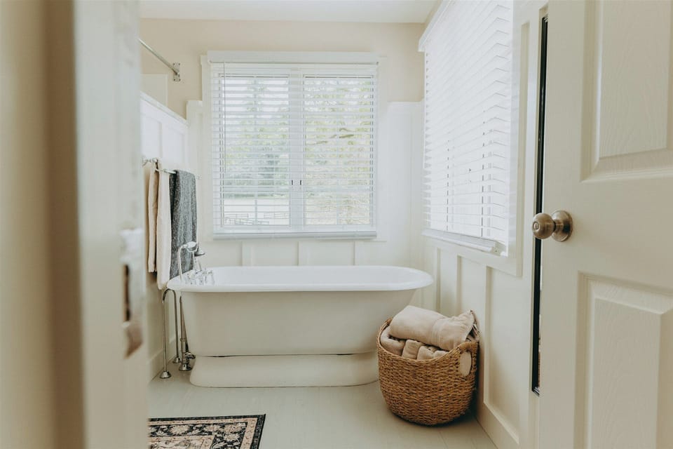 Pamper yourself in the floating tub of the master bathroom while enjoying the views of the pond.

