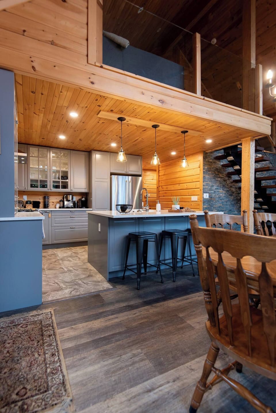 A chef’s dream kitchen—high-end appliances, spacious counters, and warm wood accents throughout.