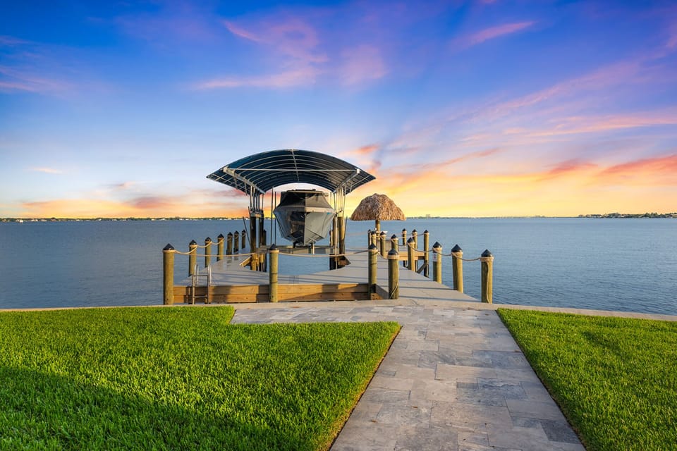 Breathtaking waterfront views await from your private dock at sunset!