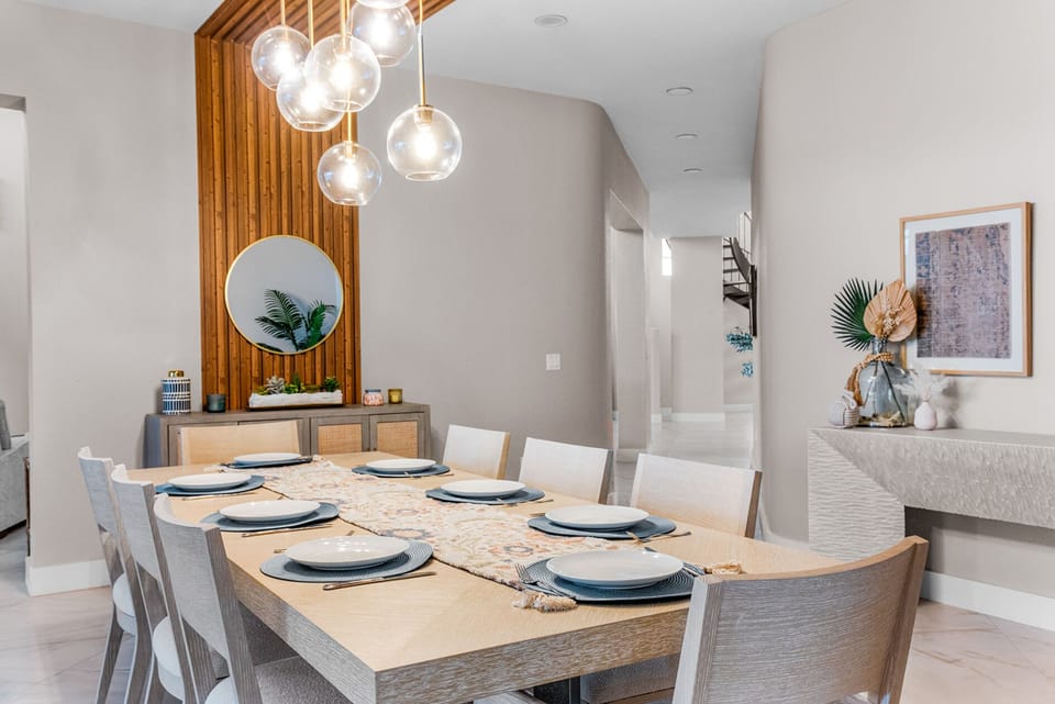 Gather around a stylish table under chic pendant lights for unforgettable meals!