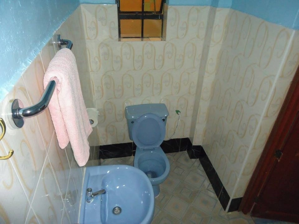 Shower, free toiletries, slippers, towels