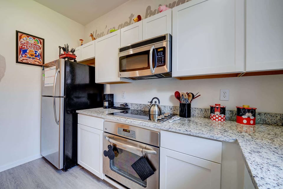 Modern kitchen with stainless steel appliances and granite countertops