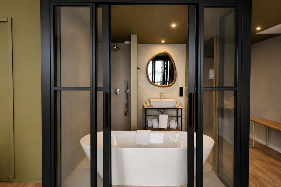 Junior Suite, Multiple Beds | Bathroom | Hair dryer, towels, soap, shampoo