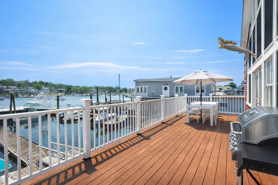Expansive deck with shade and water views