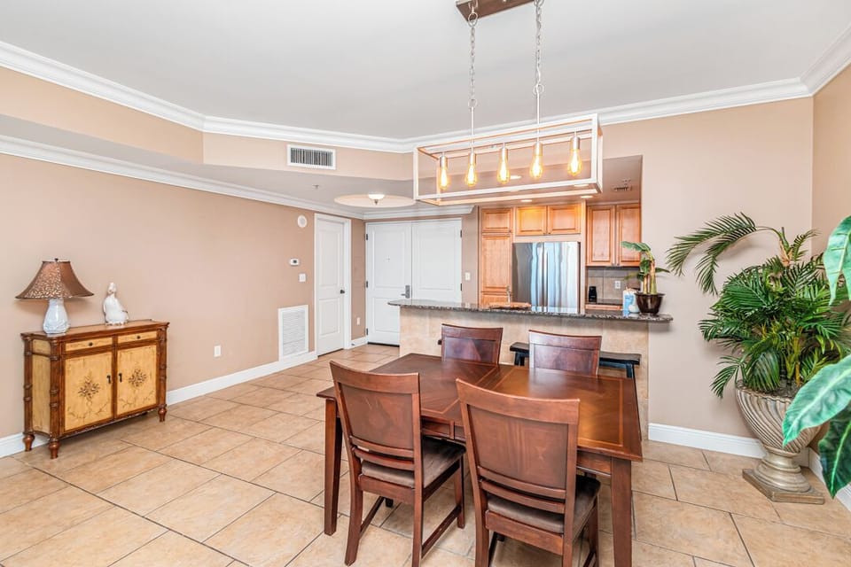 Gather around this welcoming dining space, where warm wood tones and abundant natural light set the stage for your morning coffee or evening meals together.