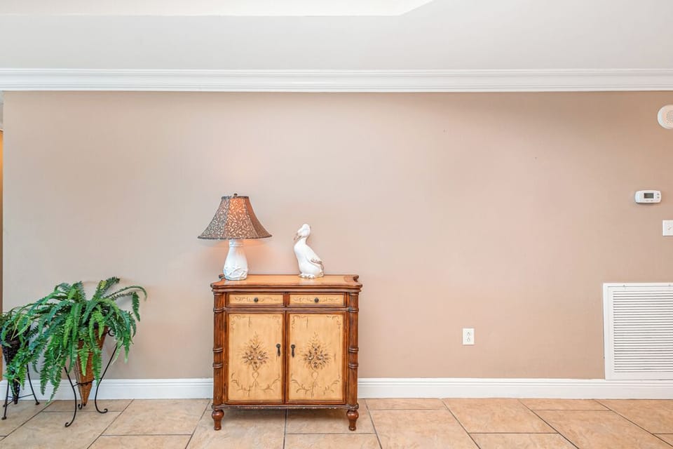 This welcoming entryway sets the tone for your stay, featuring warm tile floors and classic furnishings that blend comfort and coastal charm.