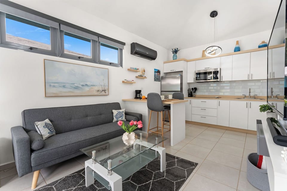 Living Room: Bright and airy space with modern decor, perfect for relaxing and enjoying the view!