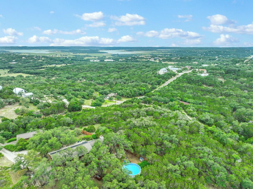 Aerial view of the property (where pool is) showing distance to Canyon Lake in the upper center of the picture.