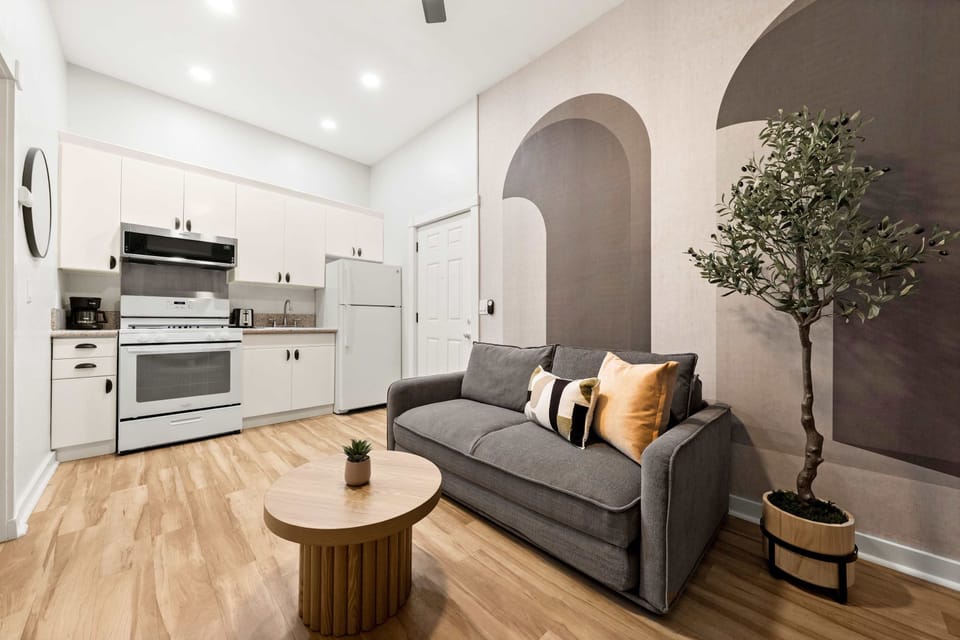 "Gather with friends or enjoy some solo time in this spacious, stylish living room 🛋️💛"
