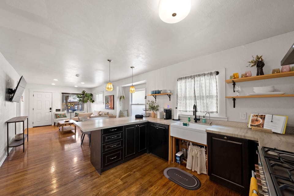 Open-concept kitchen and living room with a bright, spacious layout