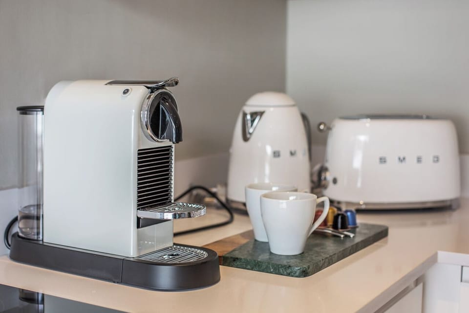 Executive Apartment, Balcony, City View | Coffee and/or coffee maker