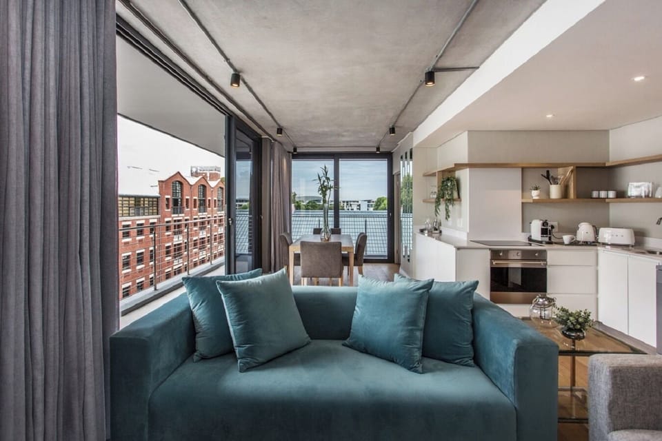 Executive Apartment, Balcony, City View | Living area | TV