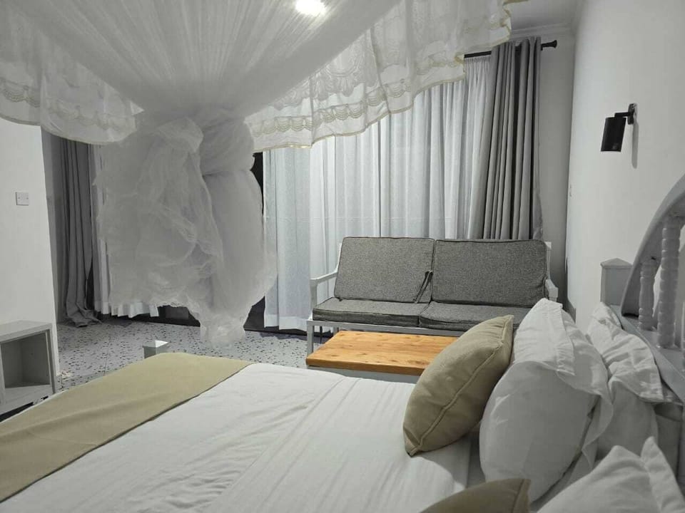 Desk, laptop workspace, blackout drapes, iron/ironing board