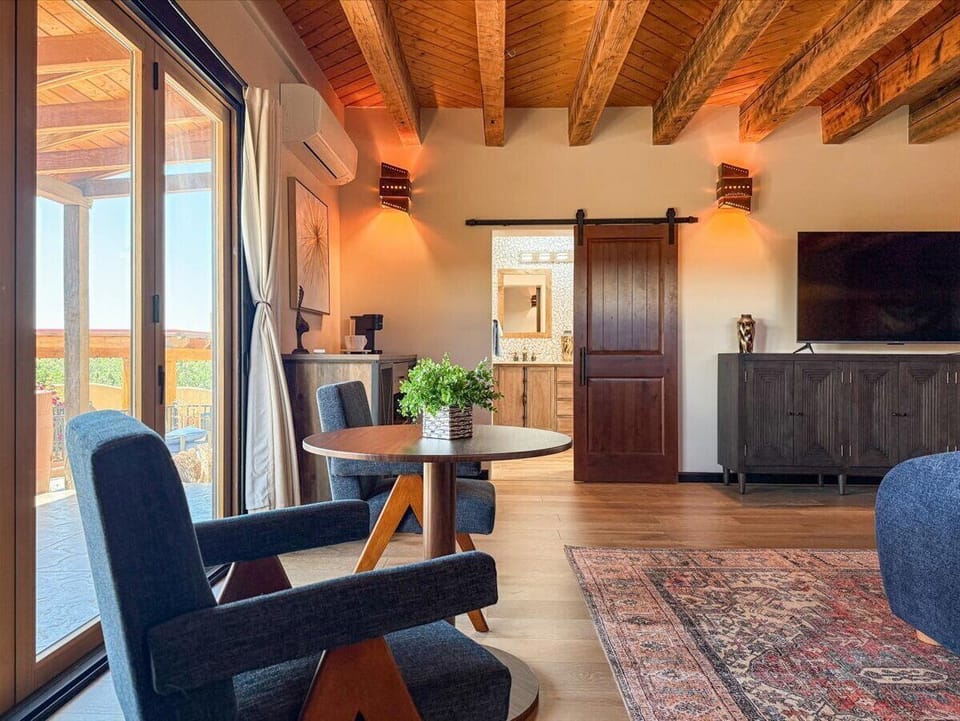 Private Main Suite Lounge with Patio Access and Inviting Natural Warmth