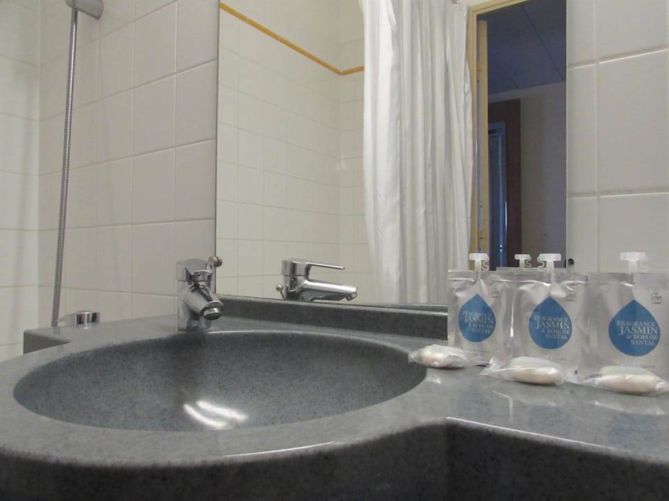 Bathtub, eco-friendly toiletries, hair dryer, towels