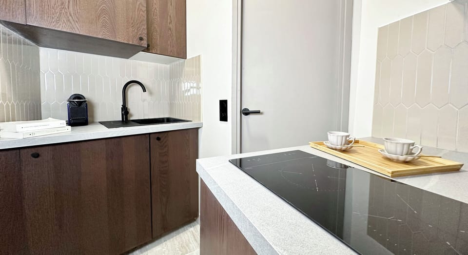 Deluxe Studio, Courtyard View | Private kitchen | Espresso maker, electric kettle, toaster, freezer