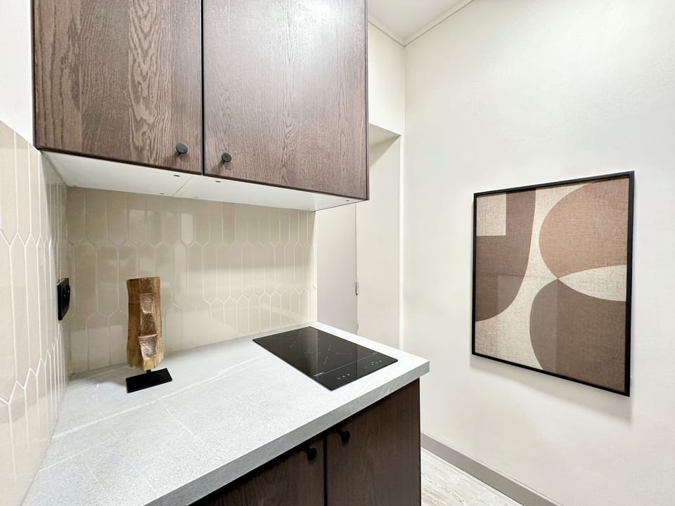 Deluxe Studio, Courtyard View | Private kitchen | Espresso maker, electric kettle, toaster, freezer