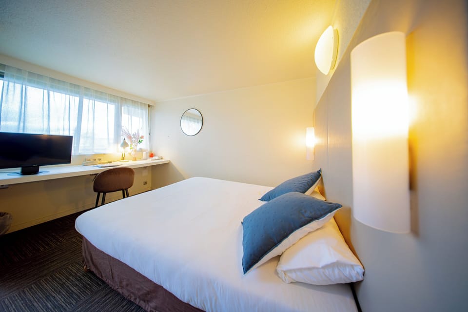 Premium bedding, desk, blackout drapes, iron/ironing board